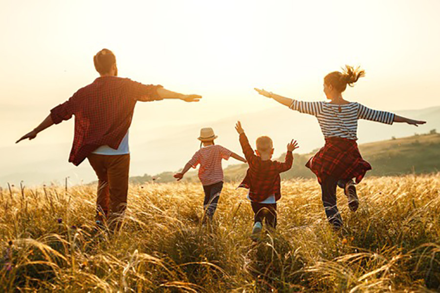 Family walking in a prarie