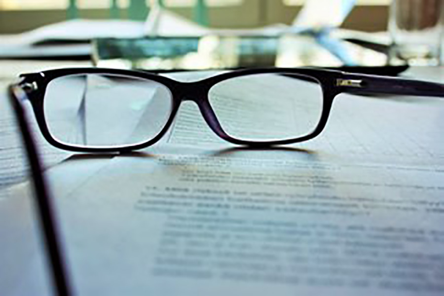 Reading glasses on top of a document