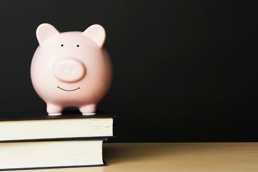 Piggybank on top of books