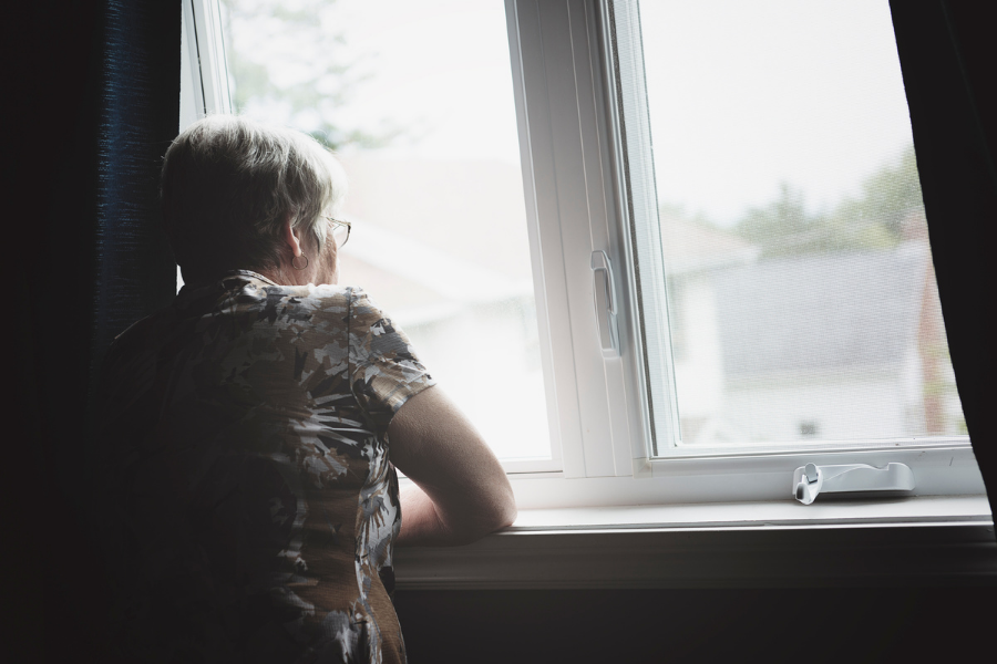 Woman looking out of a window