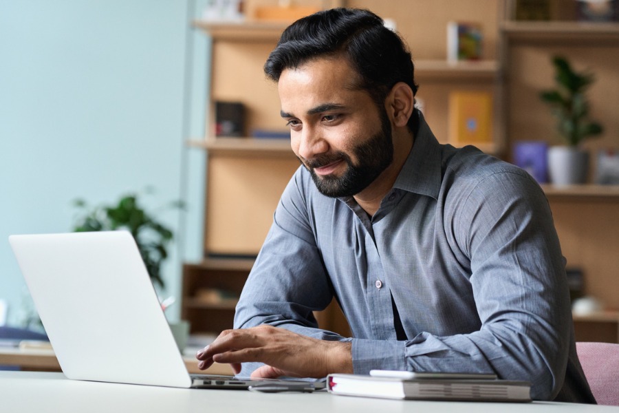 professional looking at laptop