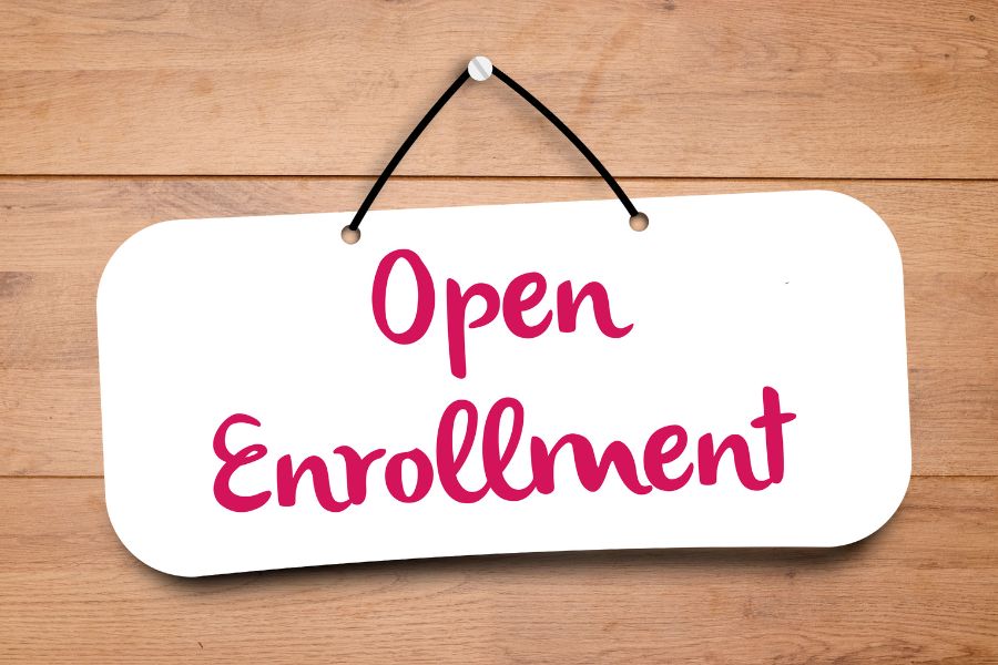 Hanging sign that read "open enrollment"