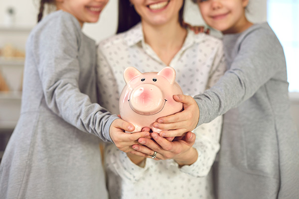 mother sharing timeless money lessons with her daughters